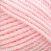 Close-up image of Plymouth Encore Worsted Yarn by Plymouth Yarn Co. in a soft, light pink shade. The yarn is thick, woolly, and loosely twisted, with a slightly fuzzy texture, filling the entire frame. The strands are evenly aligned, showcasing the detailed fiber composition and smooth pastel pink color—an economical option perfect for various projects.