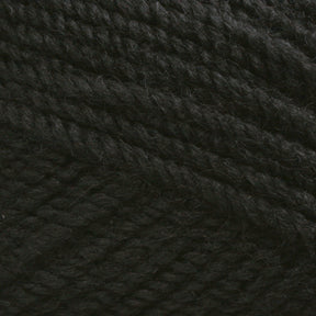 Close-up image of Plymouth Encore Worsted Yarn in black, showing the detailed texture and tightly twisted fibers. The yarn appears thick and suitable for knitting or crocheting projects, with a slightly fuzzy surface giving it a soft, cozy appearance. This product from Plymouth Yarn Co. is an economical option that is perfect for any crafting needs.