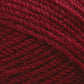 Close-up view of Plymouth Encore Worsted Yarn by Plymouth Yarn Co. in a rich burgundy hue, featuring intricate, tightly woven strands that highlight the machine washable fiber's texture and detail.