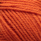 Close-up image of bright orange Plymouth Encore Worsted Yarn by Plymouth Yarn Co. The texture of this high-quality, economical option is visible, showcasing tightly twisted strands that are also machine washable.