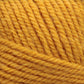 Close-up image of a ball of Plymouth Encore Worsted Yarn. The thick, soft fibers are tightly wound in a circular pattern, showcasing the texture and detail of the worsted weight yarn strands. This machine washable yarn from Plymouth Yarn Co. is an economical option for various knitting projects.