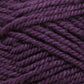 Close-up image of Plymouth Encore Worsted Yarn strands in dark purple, showcasing the texture and thickness of the fibers. The yarn appears soft with some slight fuzziness, highlighting its woolly material. This economical option from Plymouth Yarn Co. is also machine washable, making it both practical and versatile.