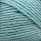 Close-up image of soft, thick Plymouth Encore Worsted Yarn by Plymouth Yarn Co., tightly coiled in a ball. The yarn is a pastel, light blue color with a slightly fuzzy texture that adds a cozy appearance. This worsted weight yarn is an economical option for knitters looking for both quality and value.