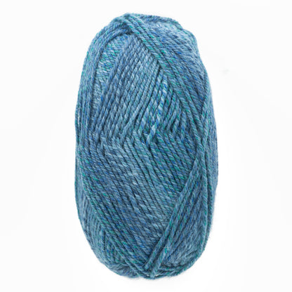 A close-up image of a skein of Plymouth Encore Worsted Yarn from Plymouth Yarn Co. in varying shades of blue and green. The worsted weight yarn is tightly wound into an oblong shape, showcasing its soft and textured fibers. The background is plain and white, highlighting the yarn's colors and texture.