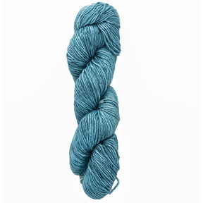 A twisted skein of Malabrigo Silky Merino by Malabrigo Yarn in blue against a pristine white background.