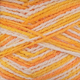 A close-up view showcases the breathable, multicolored strands of Regia Cotton Tutti Frutti Color yarn by Sirdar - Regia, Schachenmayr & Rowan. This self-striping yarn features vibrant shades of yellow, orange, and white, blending into a lively mix of warm colors with a detailed texture.