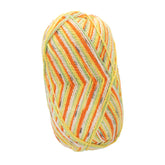 A skein of Regia Cotton Tutti Frutti Color sock yarn by Sirdar - Regia, Schachenmayr & Rowan showcases vibrant, multicolored stripes in shades of orange, yellow, green, and white.