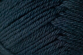 Close-up image of tightly wound dark blue yarn from Jo Sharp Classic DK Wool by Kingfisher Yarn & Fibre, showcasing the texture and individual strands of the fibers. This wool appears thick and soft with a slightly glossy finish. The image captures the intricate details of the weave and slight variations in color, highlighting its versatile DK gauge.