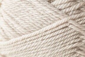 Close-up image of Kingfisher Yarn & Fibre's Jo Sharp Classic DK Wool in beige, showcasing detailed texture of the tightly wound fibers. The strands overlap and intertwine, creating a soft, layered pattern with subtle variations in shade, highlighting the versatile DK gauge.