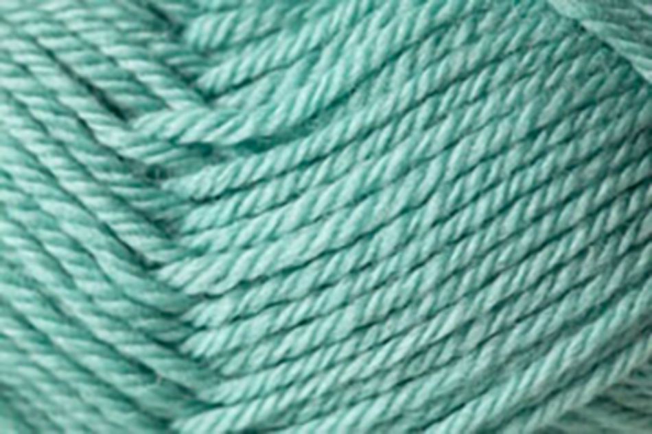 A close-up view of soft, teal-colored yarn made from Jo Sharp Classic DK Wool by Kingfisher Yarn & Fibre. The yarn is tightly wound, showcasing a slightly fuzzy texture and twisted strands. The vibrant color and detailed texture are the main focal points of the image.