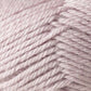 A close-up shot of a ball of Jo Sharp Classic DK Wool in light beige, from Kingfisher Yarn & Fibre, highlighting its tightly wound strands and soft texture.