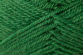 Close-up of Jo Sharp Classic DK Wool. This Kingfisher Yarn & Fibre product is tightly wound, showcasing its fibrous texture and the intricate pattern created by the threads overlapping each other. The vibrant green color highlights the uniformity and smoothness of this versatile DK gauge yarn, perfect for any project.