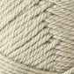 Close-up image of a ball of light beige yarn, showing the texture and interwoven strands. The Jo Sharp Classic DK Wool from Kingfisher Yarn & Fibre appears thick and is tightly wound, highlighting a detailed pattern of overlapping fibers. This versatile DK gauge yarn exemplifies premium grade wool quality.