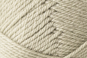 Close-up image of a ball of light beige yarn, showing the texture and interwoven strands. The Jo Sharp Classic DK Wool from Kingfisher Yarn & Fibre appears thick and is tightly wound, highlighting a detailed pattern of overlapping fibers. This versatile DK gauge yarn exemplifies premium grade wool quality.