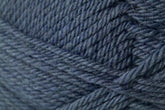 Close-up of dark blue Jo Sharp Classic DK Wool from Kingfisher Yarn & Fibre shows the intricate texture and parallel strands. The yarn appears thick and soft, tightly wound in a skein, exemplifying its premium grade quality.