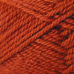 Close-up image of tightly wound, rust-colored yarn. The yarn's texture is prominent, showcasing its fibrous, twisted strands arranged in a diagonal pattern within the skein. This is Kingfisher Yarn & Fibre's Jo Sharp Classic DK Wool, perfect for your finest knitting projects.