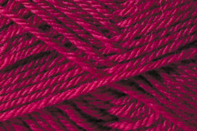 A close-up of deep pink Jo Sharp Classic DK Wool from Kingfisher Yarn & Fibre, wound tightly in a crisscross pattern, showcasing the texture and individual strands. The color appears rich and vibrant, with mild variations in shade due to lighting and the twist of the fibers.