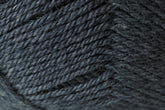 Close-up view of a skein of Jo Sharp Classic DK Wool by Kingfisher Yarn & Fibre. The texture showcases tightly wound fibers with a slightly heathered appearance, highlighting the intricate details and softness of the premium-grade wool, perfect for versatile DK gauge projects.