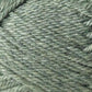 Close-up view of a ball of Jo Sharp Classic DK Wool yarn from Kingfisher Yarn & Fibre, featuring tightly wrapped strands with a slight sheen. The soft, green texture and weaving pattern are visible, highlighting the intricate details of this versatile DK gauge yarn. Ideal for knitting, crocheting, or crafting projects.