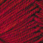 Close-up image of red yarn with visible fibers and strands twisted together, showing a textured pattern. The yarn appears soft and tightly spun, ideal for knitting or crocheting projects. This Jo Sharp Classic DK Wool by Kingfisher Yarn & Fibre showcases a vibrant red with subtle variations in shade, perfect for versatile DK gauge creations.