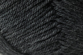 Close-up of Kingfisher Yarn & Fibre's Jo Sharp Classic DK Wool rolled into a ball. The texture is soft, with individual strands twisted together to form a thick, woolly thread. Crafted from premium grade wool, the fibers have a slight sheen and the overall appearance is densely packed and ready for use in knitting or crochet.