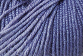 Close-up image of a ball of lavender-colored Jo Sharp Mulberry Silk Georgette Yarn from Kingfisher Yarn & Fibre, with tightly wound strands. The texture of the yarn is clearly visible, showcasing a soft and slightly shiny appearance, reminiscent of heirloom items crafted with Extrafine Merino Wool.