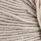 Close-up image of Jo Sharp Mulberry Silk Georgette Yarn by Kingfisher Yarn & Fibre tightly wound in a skein, showcasing the texture and fibers. The beige strands are uniformly twisted and appear soft, suitable for knitting or crochet projects, perfect for creating heirloom items.