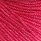 Close-up image of Jo Sharp Mulberry Silk Georgette Yarn by Kingfisher Yarn & Fibre, showing its tightly twisted strands and smooth texture. Made from extrafine Merino wool, the bright pink yarn is evenly colored and appears soft, suitable for knitting or crocheting heirloom items. The detailed texture of the fibers is clearly visible.