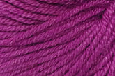 Close-up image of magenta-colored Jo Sharp Mulberry Silk Georgette Yarn by Kingfisher Yarn & Fibre. The texture shows tightly twisted fibers creating a smooth and consistent appearance. The yarn strands are parallel, highlighting the thickness and sheen of the material.