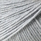 Close-up image of light grey Jo Sharp Mulberry Silk Georgette Yarn from Kingfisher Yarn & Fibre. The fibers are tightly spun and smooth, showcasing the texture and evenness of the threads, reminiscent of heirloom items crafted with care.