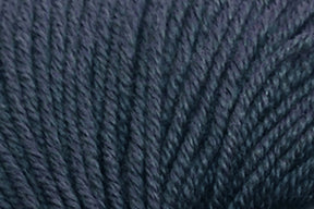 Close-up photograph of dark gray, slightly textured yarn. The fibers appear thick and tightly twisted, creating a consistent, smooth surface. Made from Extrafine Merino Wool, the yarn has a matte finish and the individual threads can be seen intertwining with one another.

Jo Sharp Mulberry Silk Georgette Yarn by Kingfisher Yarn & Fibre.