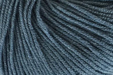 Close-up view of a skein of Jo Sharp Mulberry Silk Georgette Yarn by Kingfisher Yarn & Fibre, showcasing the tightly wound strands and soft texture.