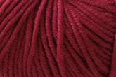 Close-up image of Jo Sharp Mulberry Silk Georgette Yarn by Kingfisher Yarn & Fibre. The yarn fibers are tightly wound, showcasing the deep burgundy hue and soft texture—ideal for crafting heirloom items that will be cherished for generations.