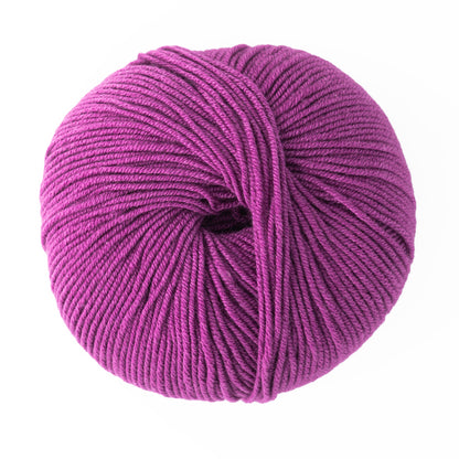 A close-up of a ball of magenta Jo Sharp Mulberry Silk Georgette Yarn by Kingfisher Yarn & Fibre. The yarn is tightly wound into a spherical shape, showcasing its soft and smooth texture. Made from luxurious Mulberry Silk, the background is plain white, emphasizing the vivid color and detailed strands of the yarn.