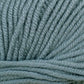 Close-up of Jo Sharp New Era Merino DK Superwash yarn in light gray-blue by Kingfisher Yarn & Fibre. The super soft fibers are tightly spun, creating a smooth and uniform texture suitable for DK weight projects like knitting or crocheting.