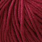 Close-up image of Jo Sharp New Era Merino DK Superwash by Kingfisher Yarn & Fibre shows deep red, machine-washable wool yarn fibers coiled together. The intricate textures and strands twist to form a thick, continuous thread that appears super soft and slightly glossy – perfect for DK weight knitting or crocheting projects.