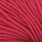 Close-up of Kingfisher Yarn & Fibre's Jo Sharp New Era Merino DK Superwash in bright red, showcasing its super soft yarn in tight loops with visible texture and fibers. The neatly wound strands make it perfect for DK weight projects, creating a pattern of parallel lines. The vibrant color remains consistent throughout the image.