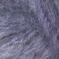 Close-up image showcasing the predominantly gray, woolly texture of Kingfisher Yarn & Fibre's Jo Sharp Rare Comfort Kid Mohair, with subtle hints of purple and black. The dense and slightly tangled fibers create a soft, fuzzy appearance that promises rare comfort.