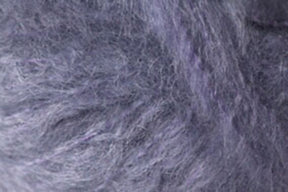 Close-up image showcasing the predominantly gray, woolly texture of Kingfisher Yarn & Fibre's Jo Sharp Rare Comfort Kid Mohair, with subtle hints of purple and black. The dense and slightly tangled fibers create a soft, fuzzy appearance that promises rare comfort.