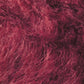 Close-up image of fuzzy, reddish-pink textured fabric, with visible fibers creating a soft and slightly fluffy appearance, reminiscent of the comfort found in Kingfisher Yarn & Fibre's Jo Sharp Rare Comfort Kid Mohair airy sweaters.