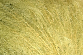 Close-up image of a field of tall, pale yellow grass or hay. The individual blades are thin and wispy, creating a textured and slightly chaotic appearance akin to Jo Sharp Rare Comfort Kid Mohair by Kingfisher Yarn & Fibre. The overall effect is a dense mat of soft, golden strands, offering rare comfort reminiscent of airy sweaters.