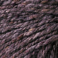 Close-up of a textured ball of Kingfisher Yarn & Fibre's Jo Sharp Silkroad Aran Tweed in varying shades of purple and grey. The strands are tightly spun, showcasing the natural fibers and slight color variations. Rich tweed highlights emphasize the intricate details and softness of this luxurious yarn.