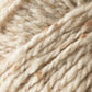 Close-up image of cream-colored wool yarn with slightly speckled, rich tweed highlights. The thick strands are twisted together, revealing the luxurious and soft fibrous nature of this Kingfisher Yarn & Fibre Jo Sharp Silkroad Aran Tweed material.