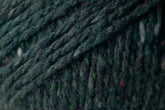 Close-up image of dark green, slightly speckled yarn with a textured, woven appearance. This Kingfisher Yarn & Fibre Jo Sharp Silkroad Aran Tweed yarn features rich tweed highlights, with fibers that appear thick and tightly twisted, creating a dense and rustic look suitable for knitting, crocheting, or other textile crafts.