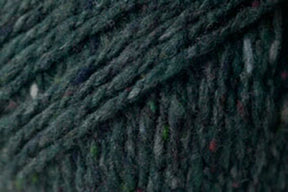 Close-up image of dark green, slightly speckled yarn with a textured, woven appearance. This Kingfisher Yarn & Fibre Jo Sharp Silkroad Aran Tweed yarn features rich tweed highlights, with fibers that appear thick and tightly twisted, creating a dense and rustic look suitable for knitting, crocheting, or other textile crafts.