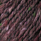 Close-up image of a luxurious yarn in shades of maroon, purple, pink, and hints of green. The fibers are intertwined, creating a variegated and slightly fuzzy appearance with rich tweed highlights reminiscent of Kingfisher Yarn & Fibre's Jo Sharp Silkroad Aran Tweed.