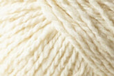 Close-up image of Jo Sharp Silkroad Aran Tweed by Kingfisher Yarn & Fibre, showcasing a ball of luxurious, cream-colored yarn with a soft, slightly fuzzy texture. The strands are twisted together, creating a chunky, cozy appearance with rich tweed highlights.