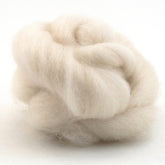 A close-up image of a fluffy, white ball of Punta Wool Top Fiber by Jagger Brothers, Inc. The fiber is soft and has a light, airy texture, with strands loosely twisted together, forming a voluminous, cloud-like appearance against a plain white background—perfect for spinning enthusiasts.