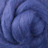 Close-up of a tightly coiled bundle of soft blue Corriedale New Zealand Wool Fiber to Spin and Felt from Ashford Handicrafts Limited. The colorful fibers have a slightly fuzzy texture and a rich, vibrant hue. The coiled structure creates an impression of swirls and layers within the wool, perfect for spinning and felting enthusiasts.