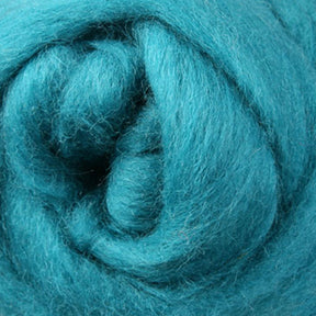 Close-up image of a swirl of soft, fluffy turquoise spinning fiber. The texture is smooth and feathery, showcasing Ashford Handicrafts Limited's Corriedale New Zealand Wool Fiber to Spin and Felt in an intricate, spiral design.